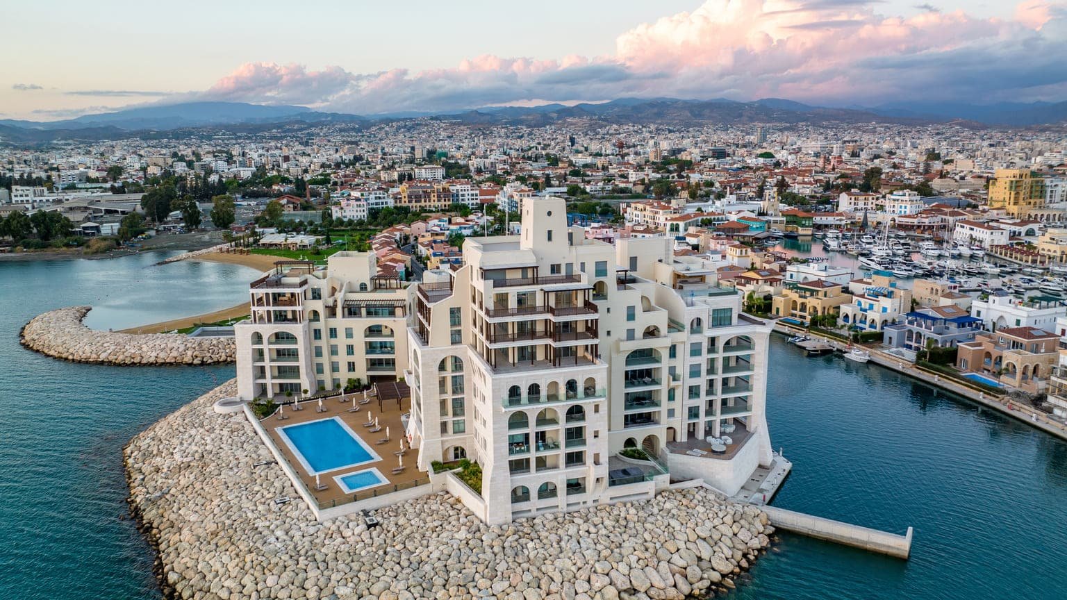 Which city in Cyprus has the most expensive houses and flats for sale?