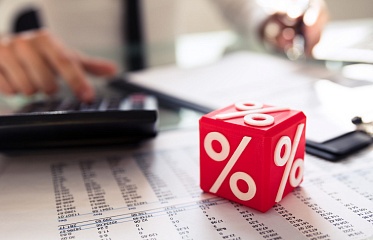 Which bank in Cyprus offers the most favourable rates on loans and deposits?