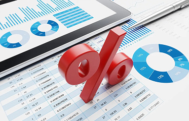 Which bank in Cyprus offers the most favourable loan and deposit rates?